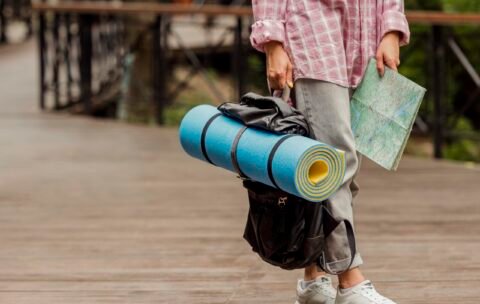 woman-holding-map-her-baggage